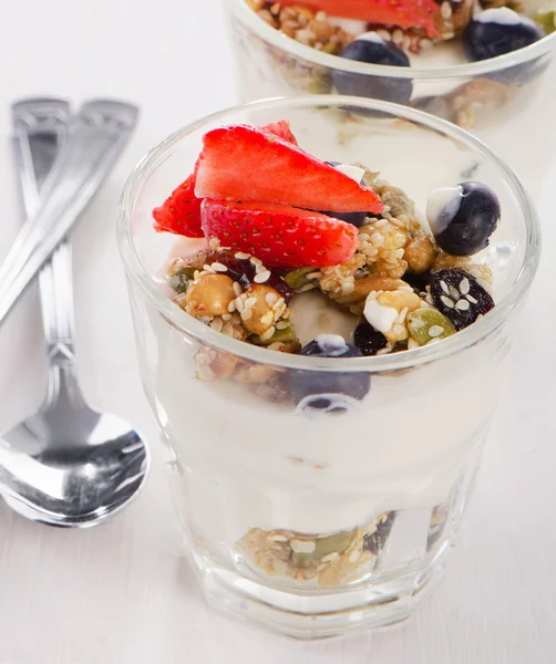 Granola with yogurt and berries in a glass — Stock Photo, Image