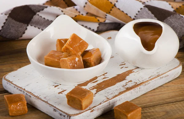 Caramel candies  on board. — Stock Photo, Image