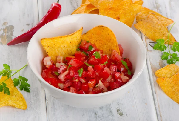 Bowl of a fresh salsa dip with chips — Stock Photo, Image