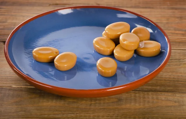 Caramelo caramelos sobre fondo de madera . — Foto de Stock