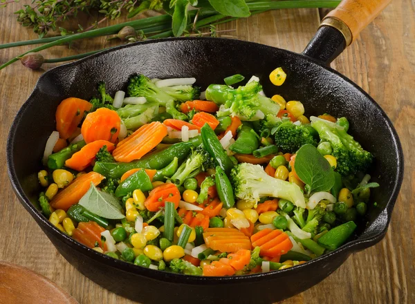 Vegetables in iron skillet — Stock Photo, Image