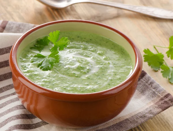 Creamy vegetable soup on a wooden table. — Stock Photo, Image