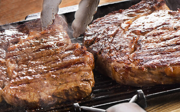 Beef steak on grill pan. Selective focus