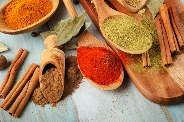 Powder spices on spoons — Stock Photo, Image