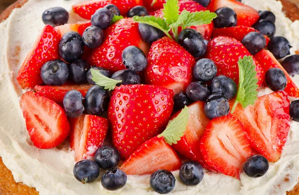 Strawberry and blueberry  on  wooden background. — Stock Photo, Image