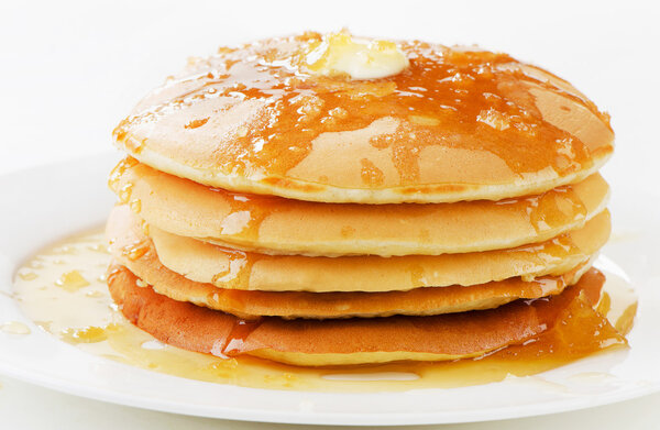 Pancakes topped with honey