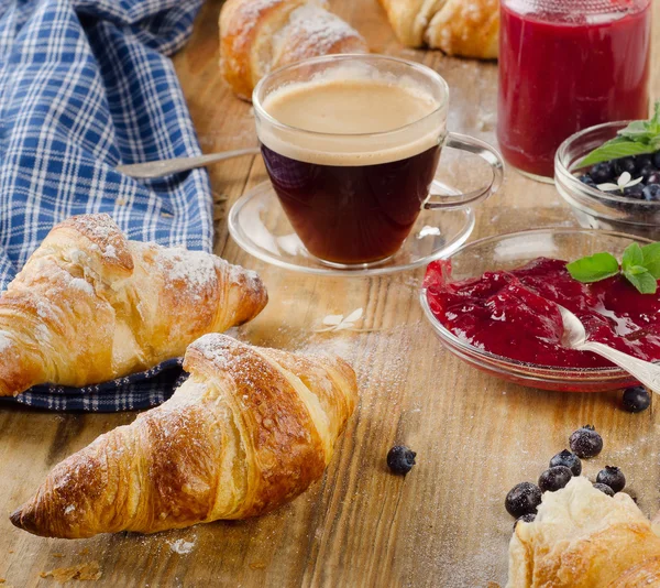 Cup of Coffee and croissants — Stock Photo, Image