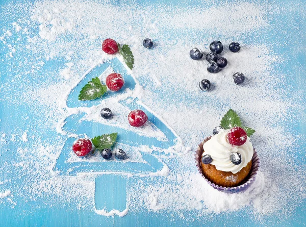 Sweet christmas decorations with cupcake — Stockfoto