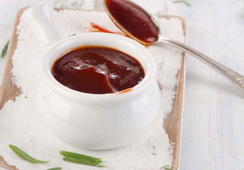 Sweet bbq sauce in  a white bowl.