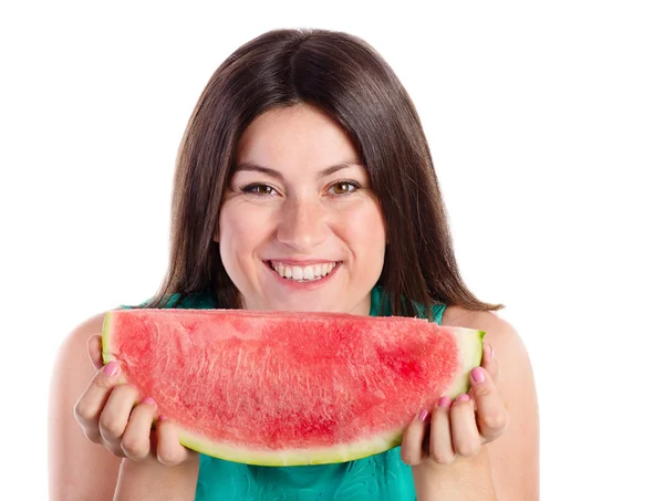 Ung kvinna med en skiva vattenmelon — Stockfoto
