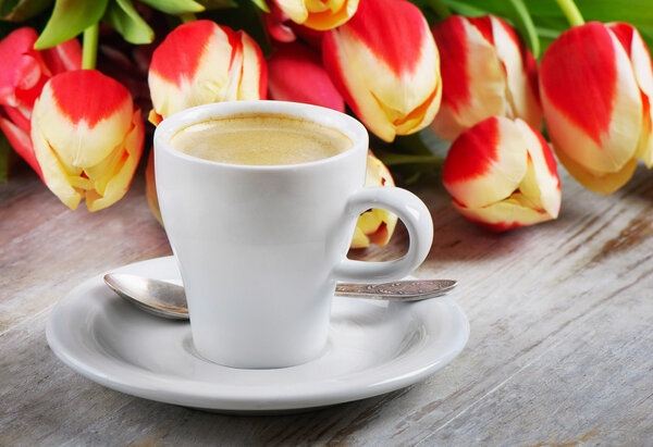 Coffee and tulips in close up