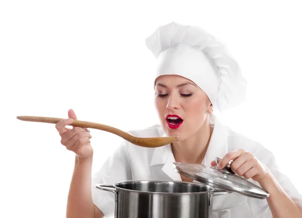 Nő szakács szakács fakanállal. — Stock Fotó