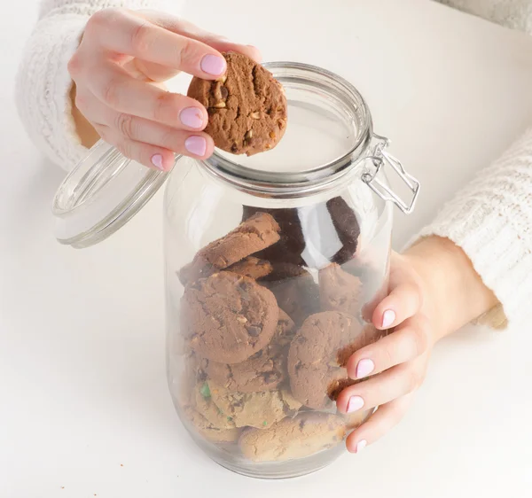 Woman  hands with chocolate cookies — Stock Photo, Image