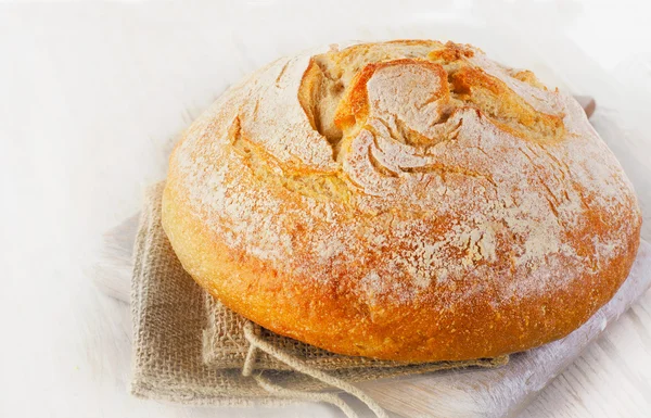 Traditional homemade bread on wooden table. — Stock Photo, Image