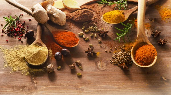 Various spices on a wooden board — Stock Photo, Image