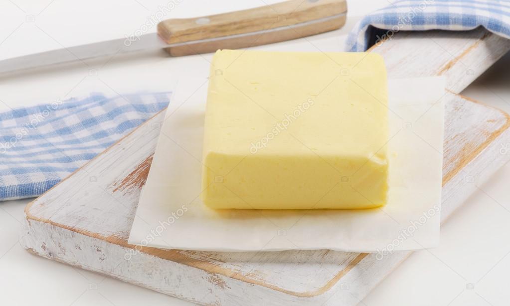 Butter on a white wooden board