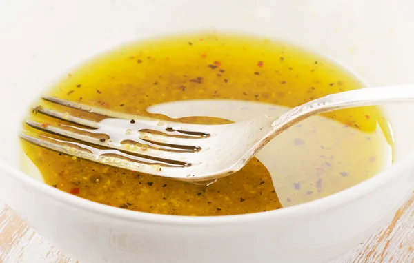 Salad dressing in a white bowl — Stock Photo, Image