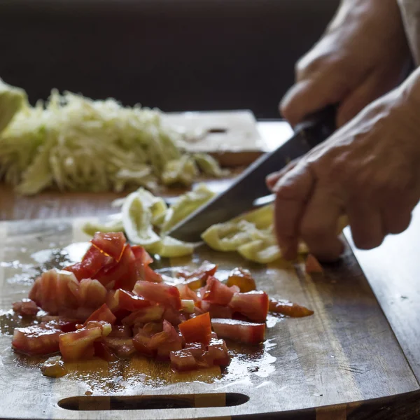 Woman cutting  vegetables — Stock Photo, Image