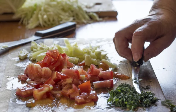 Woman cutting  vegetables — Stock Photo, Image