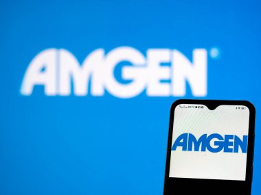 Kiev, Ukraine, May 26, 2021.   In this photo illustration AMGen, Inc. logo seen displayed on a smartphone
