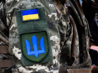 Chevron with the coat of arms of Ukraine on the sleeve military participate in a rehearsal of military parade on occasion of the Independence Day at Khreschatyk Street clipart