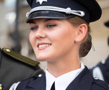 Lovely girl police officer participate in a rehearsal of military parade on occasion of the Independence Day at Khreschatyk Street clipart