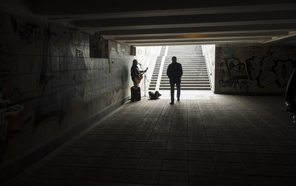 Musician playing in the underpass