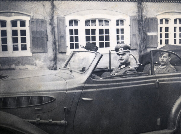 German officer posing in convertible