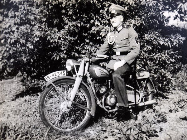 German oficer posing on a motorcycle