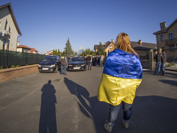 Girl wrapped Ukrainian flag