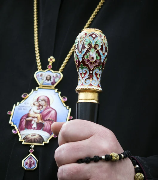 Catholic priest holds a stick — Stock Photo, Image