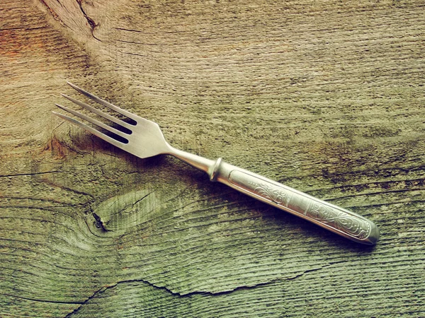 Dining fork on wooden background — Stock Photo, Image