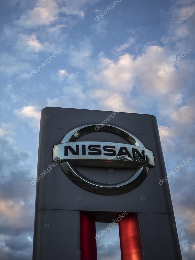 MOSCOW, RUSSIA - Aug 15, 2015: Nissan logo against evening sky. Nissan Motor Company Ltd is a multinational car manufacturer headquartered in Yokohama, Japan.