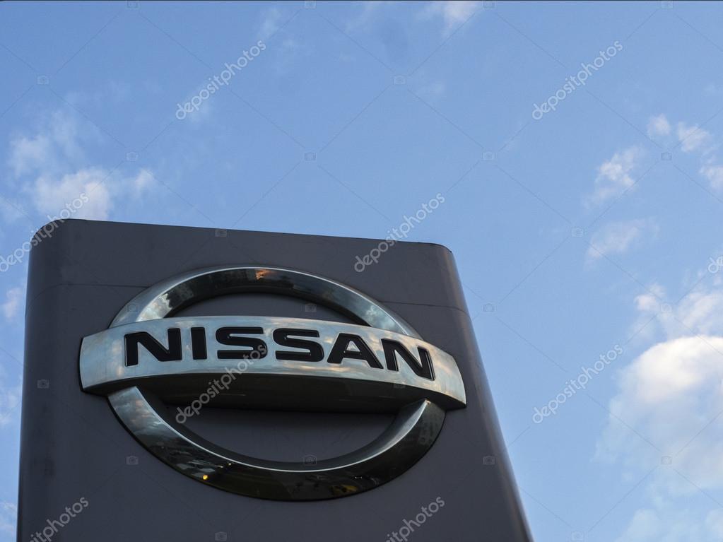 MOSCOW, RUSSIA - Aug 15, 2015: Nissan logo against evening sky. Nissan Motor Company Ltd is a multinational car manufacturer headquartered in Yokohama, Japan