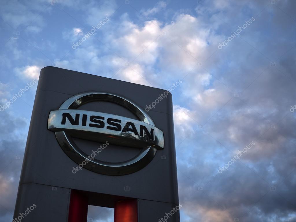 MOSCOW, RUSSIA - Aug 15, 2015: Nissan logo against evening sky. Nissan Motor Company Ltd is a multinational car manufacturer headquartered in Yokohama, Japan