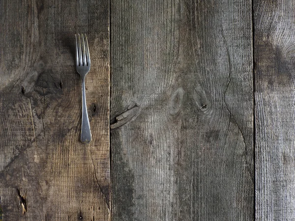 Rustic fork on wood — Stock Photo, Image