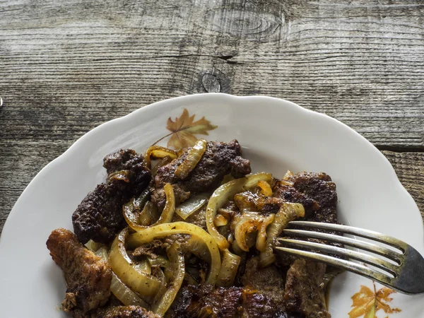 Pieses of pork fried with slised onion — Stock Photo, Image