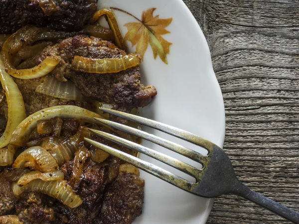 Pieses of pork fried with slised onion — Stock Photo, Image