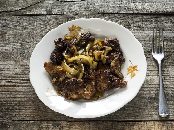 Pieses of pork fried with slised onion — Stock Photo, Image