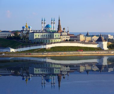 kazan kremlin with reflection in river at sunset clipart