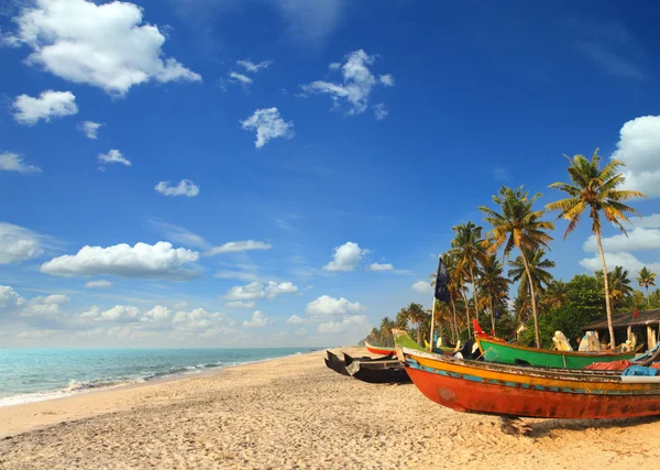 Old fishing boats on beach in india Stock Image