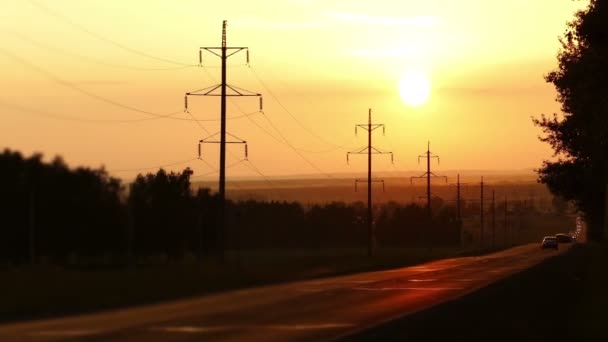 Cars on road against sunset — Stock Video