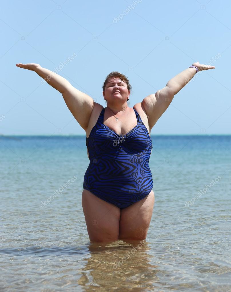 https://st2.depositphotos.com/1000597/8236/i/950/depositphotos_82360062-stock-photo-overweight-woman-standing-in-sea.jpg