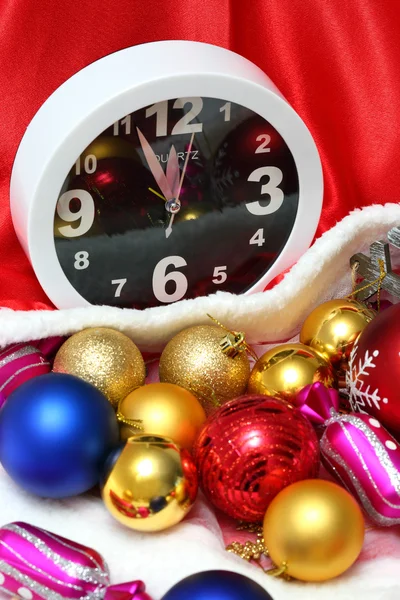 Clock and christmas balls and toys — Stock Photo, Image