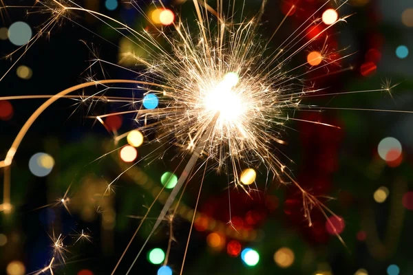 Sparkler burning on festive background — Stock Photo, Image