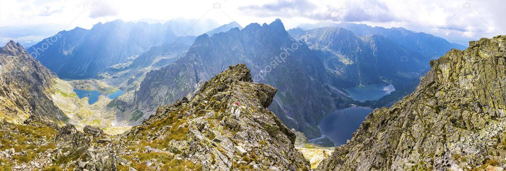 Panorama of High Tatras mountains. View from mt Rysy (2503m) on the border between Slovakia (left) and Poland (right). Zabie lakes (Slovakia) and Morskie Oko lake (Poland) on background