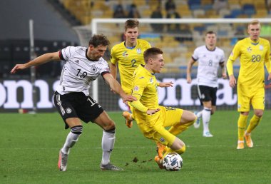 KYIV, UKRAINE - OCTOBER 10, 2020: UEFA Nations League game Ukraine v Germany at NSK Olimpiyskiy stadium in Kyiv. Leon Goretzka of Germany (L) and Viktor Tsygankov of Ukraine. Germany won 2-1