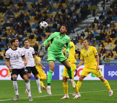 KYIV, UKRAINE - OCTOBER 10, 2020: UEFA Nations League game Ukraine v Germany at NSK Olimpiyskiy stadium in Kyiv. Leon Goretzka of Germany (L) and goalkeeper Georgiy Bushchan of Ukraine