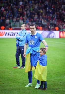 Artem Fedetskiy and his son react after FC Dnipro loses the Fina