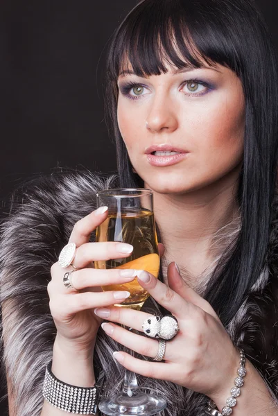 Woman with glass of sparkling wine — Stock Photo, Image